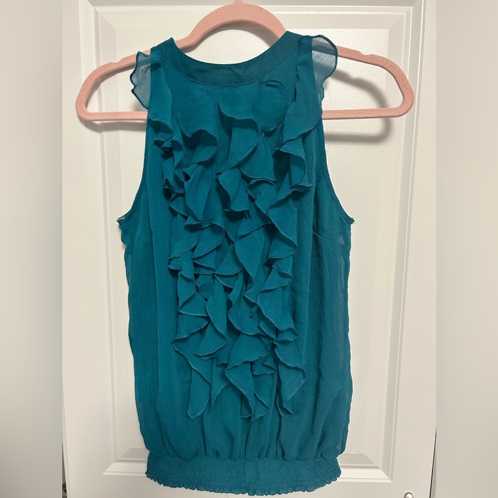 Mossino Supply Co. Teal blouse with ruffles in the front . Good condition.